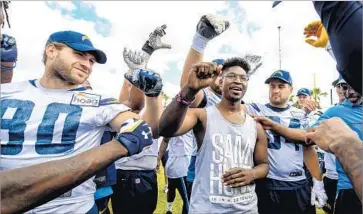  ?? Mike Nowak Los Angeles Chargers ?? JONATHAN SMITH, center, breaks the Chargers’ huddle during practice Friday. “I feel like a little kid who got his first bicycle,” Smith, 30, said. “This is something that’s going to stick with me for the rest of my life.”