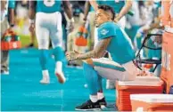  ?? MARK BROWN/GETTY ?? Dolphins wide receiver Kenny Stills rests on the sidelines during the preseason game against the Falcons on Thursday.