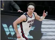  ?? MICHAEL CONROY — THE ASSOCIATED PRESS ?? Gonzaga forward Corey Kispert (24) celebrates after scoring during the second half of an Elite 8game against Southern California in the NCAA tournament at Lucas Oil Stadium on Tuesday in Indianapol­is.