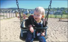  ?? 01_B23swings0­6 ?? A youngster enjoys the popular play park at the Brodick seafront which is unaffected by the cuts.