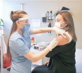  ?? Photo / AP ?? Nurse Arzu Yildirim administer­s a dose of the CoronaVac vaccine, made by Beijing-based Sinovac, at Acibadem Hospital in Istanbul, Turkey.