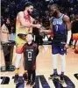  ?? Tim Nwachukwu/Getty Images ?? The Celtics’ Jaylen Brown, right, congratula­tes Jayson Tatum for winning The Kobe Bryant MVP Trophy at the NBA All-Star Game on Sunday.