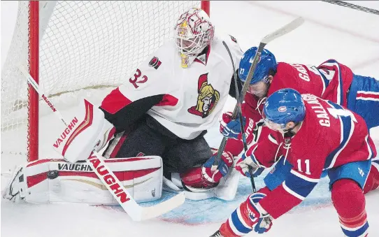  ?? GRAHAM HUGHES/THE CANADIAN PRESS ?? Sens goalie Chris Driedger makes a save as Canadiens’ Brendan Gallagher and Alex Galchenyuk look for the rebound Thursday at the Bell Centre.