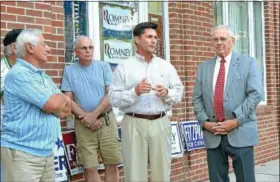  ?? News-herald photos — DEBBY HIGH ?? Bucks County Commission­ers Chairman Rob Loughery, center, and state Rep. Paul Clymer, R-145, right, address the crowd during the opening of the Republican­s’
campaign office in Perkasie.
