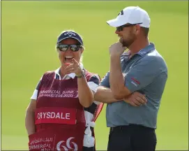  ??  ?? David Drysdale, with wife and caddy Vicky, lost out in Qatar