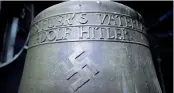  ?? — AFP ?? A Nazi- era church bell that bears a swastika and the words ‘ All for the Fatherland — Adolf Hitler’ hanging in the steeple of the St Jakob church in Herxheim am Berg, western Germany.