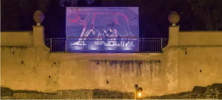  ??  ?? In the Villa Massimo in Rome, artists under isolation present videos, pictures and music over their walls for their neighbours to see. — VILLA MASSIMO/DPA
