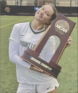  ?? Courtesy Photo ?? Hart High alumna Jensen Shrout holds the NCAA Regional Championsh­ip trophy following a 1-0 victory by the Point Loma Sea Lions against the Washburn Ichabods. Photo Courtesy of Stephanie Shrout.