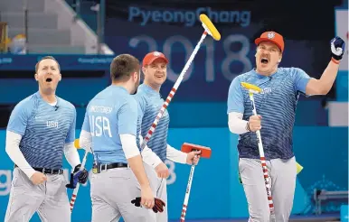  ?? NATACHA PISARENKO/ASSOCIATED PRESS ?? From left, the United States’ Tyler George, John Landsteine­r, skip John Shuster and Matt Hamilton celebrate winning their men’s semifinal match against Canada on Friday.