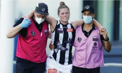  ?? Photograph: Michael Willson/AFL Photos/Getty Images ?? Brianna Davey leaves the field after sustaining a serious knee injury in Collingwoo­d’s opening round game against Carlton.