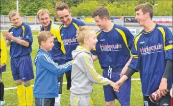  ?? Picture: Martin Apps FM2612923 ?? Luke Pye, from Park Wood, shaking hands with players from Tarmac FC taking part in the charity football match in his honour