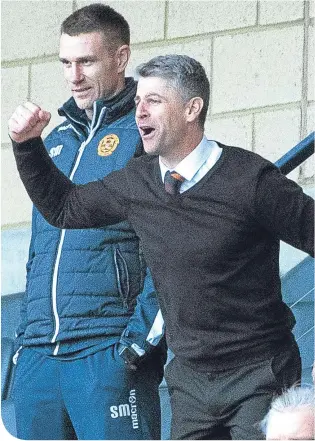  ??  ?? Steve Robinson celebrates last weekend’s victory over Rangers from the Hampden stand with Stephen McManus