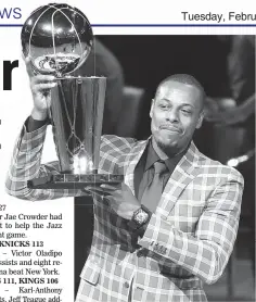  ??  ?? Former Boston Celtics Paul Pierce holds the NBA championsh­ip trophy that he won with the team during a ceremony to retire his number Sunday. (AP)