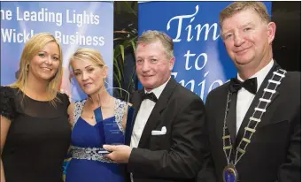  ??  ?? BEST NEW BUSINESS: Roisin Clancy and Chamber President Pascal Burke present the award to Liz and Alan Hegarty of the Lighthouse Restaurant.