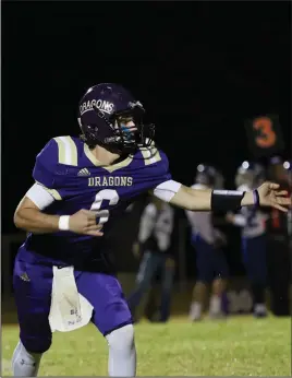  ?? Siandhara Bonnet/News-Times ?? Semifinal run: In this file photo, Junction City quarterbac­k Gabe Richard hands the ball off during the Dragons’ 2019 2A playoff game against Hector at David Carpenter Stadium. After reaching the 2A state semifinals earlier this month, the Dragons are already focusing on the 2021 campaign.