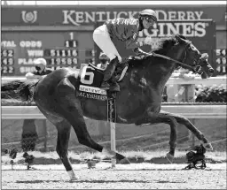  ?? EMILY SHIELDS ?? Maxfield coasts to the wire in the Alysheba on Kentucky Oaks Day. The 4-year-old Street Sense colt is 6 for 7 in his career.