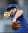  ?? MARK J. TERRILL — THE ASSOCIATED PRESS FILE ?? File-This file photo shows Chicago Cubs starting pitcher Jake Arrieta throwing to the plate.