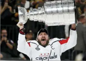  ?? JOHN LOCHER — THE ASSOCIATED PRESS FILE ?? In this file photo, Washington Capitals left wing Alex Ovechkin, of Russia, hoists the Stanley Cup after the Capitals defeated the Golden Knights in Game 5 of the NHL hockey Stanley Cup Finals, in Las Vegas.