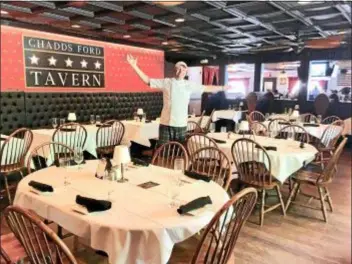  ?? PEG DEGRASSA — DIGITAL FIRST MEDIA ?? Owner/Chef Philip Ferro stands in the midst of the large, spacious dining room at the newly renovated and re-opened Chadds Ford Tavern. For more informatio­n and to view a menu, visit www.cftavern.com.