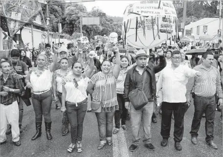  ?? Photograph­s by Liliana Nieto del Rio For The Times ?? PROTESTING teachers and their supporters have their own activities to mark the Guelaguetz­a, the annual celebratio­n of the heritage of Mexico’s culturally rich Oaxaca state. Enraged at federal education reforms, teachers have occupied a plaza in Oaxaca...