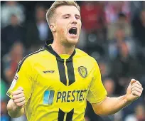  ??  ?? GET IN Burton Albion’s Jamie Allen scores and celebrates