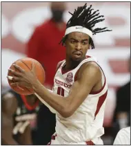  ??  ?? Senior guard Jalen Tate, who was the Horizon League defensive player of the year last season at Northern Kentucky, has been a key part of Arkansas’ success in 2020-21. Tate is averaging 11.1 points and 3.6 rebounds this season for the Razorbacks. (NWA Democrat-Gazette/Charlie Kaijo)