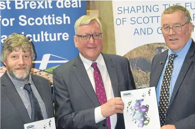  ??  ?? From left: NFUS vice-president Martin Kennedy, Rural Economy Secretary Fergus Ewing and NFUS president Andrew Mccornick with copies of the “Steps to change” policy document.