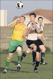  ??  ?? Rathnew’s Mark Doyle competes with Arklow’s Paddy Reid in Shamrock Park.