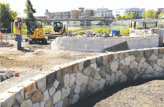  ?? Photos by Michael Macor / The Chronicle ?? A small plaza at Soscol Avenue and First Street is nearly completed above the Oxbow bypass, which doubles as flood protection and did its job in the heavy rains.