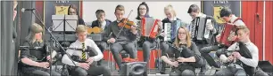  ?? Photograph: Kenny Ferguson. ?? Traditiona­l music students from Oban High School entertaine­d at the launch.