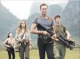  ?? Vince Valitutti Warner Bros. Pictures ?? JING TIAN, left, Brie Larson, Tom Hiddleston and Thomas Mann in “Kong: Skull Island,” the latest cinematic version of the story of the giant gorilla.