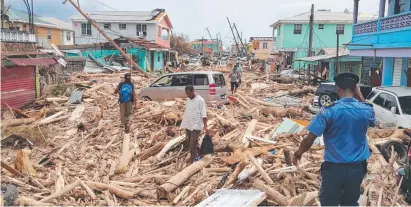  ?? HEAVY LOSSES: The damage caused by Hurricane Maria in Roseau, Dominica. ??