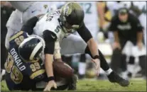  ?? THE ASSOCIATED PRESS FILE ?? Jacksonvil­le Jaguars quarterbac­k Blake Bortles fumbles the ball as he is sacked by Los Angeles Rams defensive tackle Aaron Donald during a game between the teams on Oct. 15 in Jacksonvil­le, Fla. Donald is not only a worthy counterpar­t to the Eagles’...