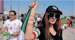  ?? | Reuters ?? A WOMAN holds up her arm showing an inscriptio­n reading ‘Woman, life, freedom’ before a match at the Ahmad Bin Ali Stadium during the FIFA World Cup in Qatar.