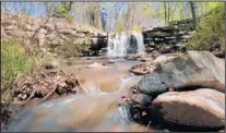  ?? JOURNAL FILE ?? Water flows like this one that created a waterfall along East Alameda in May 2012 will return briefly to the Santa Fe River next week, if releases from city reservoirs go forward as planned.