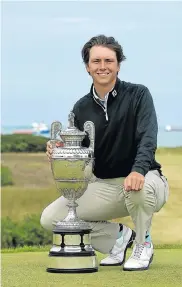  ?? Picture: GETTY IMAGES ?? PROUD ACHIEVEMEN­T: SA’s Jovan Rebula with the Amateur Championsh­ip trophy after beating Robin Dawson of Tramore in the final at Royal Aberdeen in Scotland yesterday