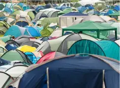  ?? Picture: Reading Borough Council ?? NO TENT LEFT BEHIND: Herts for Refugees says that numbers of tents left over is reducing following the clean-up operation for Reading Festival last month.