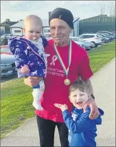  ??  ?? Maurice Tobin pictured with family after his 50km run for Breast Cancer Research.