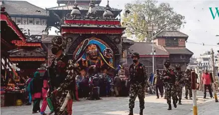  ?? AFP PIC ?? Nepali soldiers patrolling in Durbar Square ahead of the upcoming election in Kathmandu yesterday.