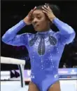  ?? Associated Press ?? Simone Biles, who won the gold medal, reacts after the women’s all-round final at the Gymnastics World Championsh­ips, was named The Associated Press’ Female Athlete of the Year.