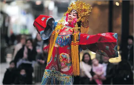  ?? DAX MELMER ?? Ivy Xu performs in the Chinese costume parade during the Chinese New Year celebratio­n at Devonshire Mall on Sunday.