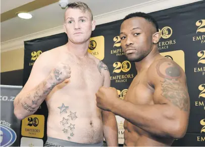  ?? Picture: Gallo Images ?? READY TO RUMBLE. Thabiso Mchunu (right) and Tommy Oosthuizen face off during the weigh-in for their Repeat or Revenge fight yesterday which takes place at Emperors Palace tonight.