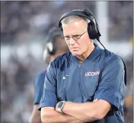  ?? Phelan M. Ebenhack / Associated Press ?? UConn coach Randy Edsall walks along the sideline during a 2019 game against UCF.