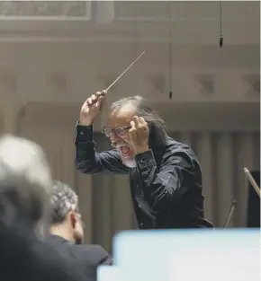  ??  ?? Ilan Volkov, co-curator of the Tectonics festival, conducting the BBC SSO