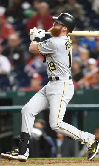  ?? Mitchell Layton/Getty Images ?? Colin Moran hits a three-run, pinch-hit home run in the 10th inning as the Pirates beat the Nationals, 6-3, April 12 in Washington. Pinch-hitters prepare in different ways — Moran sticks to his routine, only he starts it a couple of hours later.