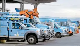  ?? AP FILE PHOTO/BEN MARGOT ?? Pacific Gas & Electric vehicles sit at the PG&E Oakland Service Center in Oakland, Calif.