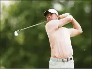  ?? Richard Heathcote / Getty Images ?? Rory McIlroy plays his shot from the 14th tee during the second round of the PGA Championsh­ip at Southern Hills Country Club Friday in Tulsa, Okla.