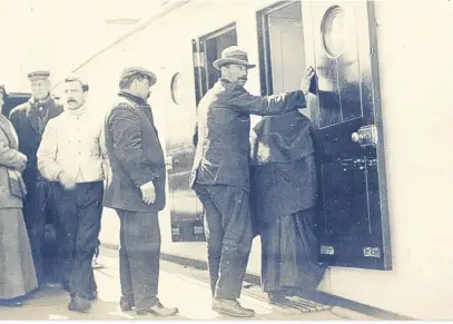  ?? PA ?? A biscuit from the Titanic could sell for £10,000 later this month. The Spillers and Bakers pilot biscuit was part of a survival kit stored in a lifeboat and rescued along with some passengers (pictured) after the ship sunk in 1912. It is being...