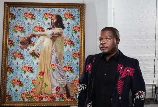  ?? Chad Batka / The New York Times ?? Kehinde Wiley, an establishe­d figurative painter, was chosen to create the former president’s official portrait for the Smithsonia­n National Portrait Gallery.