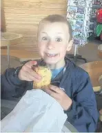  ??  ?? Alfie Frame, six, scaled Mount Snowdon in just under seven hours. Right, Alfie enjoys a well-earned snack after the climb